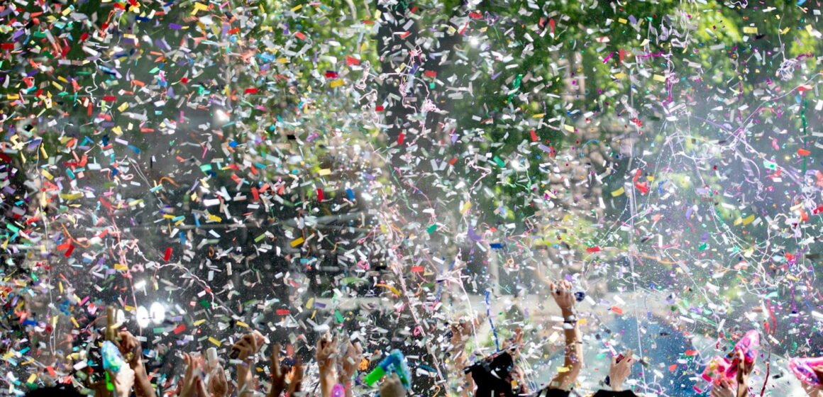 people covered by confetti